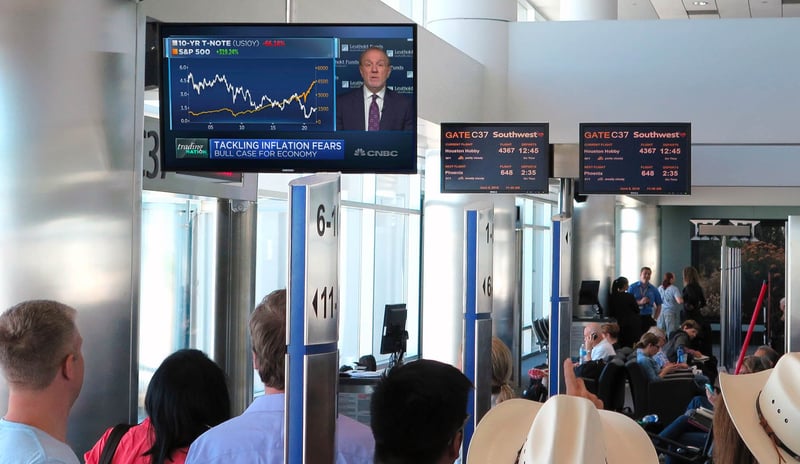 People queuing at an airport departure gate